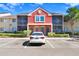 Charming condo building with colorful facade, well-maintained landscaping, and convenient visitor parking at 5729 Baywater Dr # 5729, Tampa, FL 33615