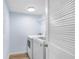 Bright laundry room features a modern washer and dryer, with extra storage space at 5729 Baywater Dr # 5729, Tampa, FL 33615