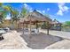 Outdoor lounge area with tiki huts and dockside seating, perfect for outdoor relaxation at 5729 Baywater Dr # 5729, Tampa, FL 33615