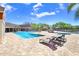 Community pool with hot tub, lounge seating, and manicured landscaping at 5729 Baywater Dr # 5729, Tampa, FL 33615