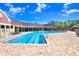Community pool with lounge seating, and manicured landscaping at 5729 Baywater Dr # 5729, Tampa, FL 33615