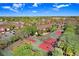 Overhead shot of tennis courts with community housing and lush surroundings on a sunny day at 5729 Baywater Dr # 5729, Tampa, FL 33615