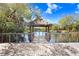 Scenic view of waterfront from wooden dock, with tiki huts for shaded relaxation at 5729 Baywater Dr # 5729, Tampa, FL 33615