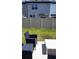 The backyard has an outdoor seating area for leisure at 11856 Throttle Pl, Gibsonton, FL 33534