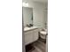 Compact bathroom with a white vanity, toilet, and shower-tub combo at 11856 Throttle Pl, Gibsonton, FL 33534