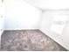 This bedroom has carpeted floors, a window and white paint at 11856 Throttle Pl, Gibsonton, FL 33534