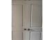Light gray closet doors with round knobs, showing a simple and clean design at 11856 Throttle Pl, Gibsonton, FL 33534