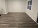Spacious living room with stylish wood flooring and lots of natural light at 11856 Throttle Pl, Gibsonton, FL 33534
