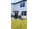 Cozy backyard patio with white vinyl siding and a new AC unit at 11856 Throttle Pl, Gibsonton, FL 33534