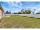 Expansive backyard, featuring a well-maintained lawn and a white fence for privacy at 669 Lakemont Dr, Brandon, FL 33510