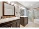 Dual sink bathroom featuring a walk-in glass shower at 669 Lakemont Dr, Brandon, FL 33510