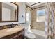 Bathroom featuring granite-like vanity, decorative tile accents, and shower over tub at 669 Lakemont Dr, Brandon, FL 33510