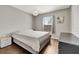 Bedroom featuring wood floors, modern lighting, and neutral decor at 669 Lakemont Dr, Brandon, FL 33510