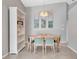Bright dining area with a modern chandelier and a view of artwork at 669 Lakemont Dr, Brandon, FL 33510