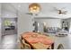Cozy dining area with stylish light fixture and tiled flooring at 669 Lakemont Dr, Brandon, FL 33510