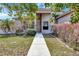 The home's front exterior boasts meticulously landscaped bushes and a welcoming walkway at 669 Lakemont Dr, Brandon, FL 33510