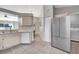 Modern kitchen with stainless steel refrigerator and appliances, and tile flooring at 669 Lakemont Dr, Brandon, FL 33510
