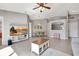 Well-lit living room showcasing a dining table and open view to other rooms at 669 Lakemont Dr, Brandon, FL 33510
