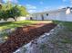 Spacious backyard with mature trees, privacy fence, and potential for outdoor living at 4800 86Th N Ave, Pinellas Park, FL 33782