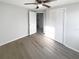 Neutral bedroom with a ceiling fan, large window, and spacious closet at 4800 86Th N Ave, Pinellas Park, FL 33782