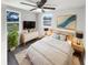 Comfortable bedroom with natural light, ceiling fan, and stylish decor at 4800 86Th N Ave, Pinellas Park, FL 33782