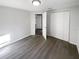 Clean, well-lit bedroom with new floors and a double door closet at 4800 86Th N Ave, Pinellas Park, FL 33782