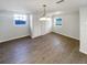 Bedroom features wood-look floors, dual closets, and two windows at 4800 86Th N Ave, Pinellas Park, FL 33782