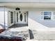 Charming front porch with decorative door and sidelights, complemented by a tiled entryway at 4800 86Th N Ave, Pinellas Park, FL 33782
