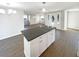 Modern kitchen island with granite countertop and ample cabinet space in an open-concept living area at 4800 86Th N Ave, Pinellas Park, FL 33782