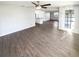 Large open living area with new floors and modern ceiling fan, perfect for entertaining guests at 4800 86Th N Ave, Pinellas Park, FL 33782