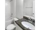 Bathroom featuring a toilet, bathtub, and granite countertop at 5139 Brickwood Rise Dr, Wimauma, FL 33598