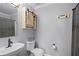 Cozy bathroom featuring rustic decor, a sliding barn door cabinet, and neutral tones at 11144 Summer Star Dr, Riverview, FL 33579