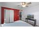 Bedroom with a ceiling fan, a closet, and an open door leading to the staircase at 11144 Summer Star Dr, Riverview, FL 33579