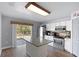 Modern kitchen featuring white cabinetry, stainless steel appliances, and granite countertops at 11144 Summer Star Dr, Riverview, FL 33579