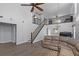 Open-concept living room showcasing the staircase and view to the second-story loft area at 11144 Summer Star Dr, Riverview, FL 33579