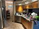 Functional kitchen with oak cabinets, stainless steel appliances, and a sink at 12403 Snowy Egret Ave, Weeki Wachee, FL 34614