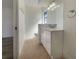 Bathroom featuring a white vanity with modern fixtures and tile flooring, offering a clean and functional space at 3527 65Th Avenue E Cir, Sarasota, FL 34243