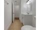 The bathroom features a white vanity with modern fixtures and neutral tile flooring, offering a clean and functional space at 3527 65Th Avenue E Cir, Sarasota, FL 34243