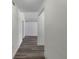 Hallway with hardwood flooring and white walls at 3527 65Th Avenue E Cir, Sarasota, FL 34243