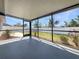 Screened in patio provides serene views of the backyard and white fence, perfect for outdoor relaxation at 3527 65Th Avenue E Cir, Sarasota, FL 34243