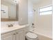 Clean bathroom with a vanity, toilet, and a tiled shower-tub combination for relaxation at 545 Frandor Pl, Apollo Beach, FL 33572