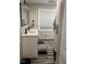Modern bathroom with double vanity, stylish fixtures, and wood-look tile flooring at 15168 Chamberlain Blvd, Port Charlotte, FL 33953