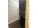 Laundry room with stacked front-load washer and dryer unit and modern finishes at 15168 Chamberlain Blvd, Port Charlotte, FL 33953