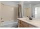 Bathroom featuring a shower and bathtub combo, and a sleek modern sink at 19104 Redbay Way, Tampa, FL 33647