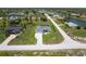 Wide aerial view of a home highlighting its screened-in pool and lengthy brick driveway at 291 Rotonda S Blvd, Rotonda West, FL 33947