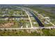 Aerial view of a neighborhood featuring beautiful waterfront properties, canals, and lush landscaping at 291 Rotonda S Blvd, Rotonda West, FL 33947
