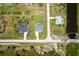Aerial view of three homes, each featuring a pool, and surrounded by lush landscaping at 291 Rotonda S Blvd, Rotonda West, FL 33947