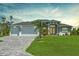 Charming home featuring a three-car garage, well-manicured lawn, and meticulously designed brick driveway at 291 Rotonda S Blvd, Rotonda West, FL 33947