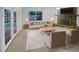 Bright living room with a stone fireplace, plush rug, neutral furniture, and French doors to the pool at 12531 70Th St, Largo, FL 33773