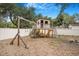 Backyard with play set, slide and wooden swings at 3307 W Ballast Point Blvd, Tampa, FL 33611